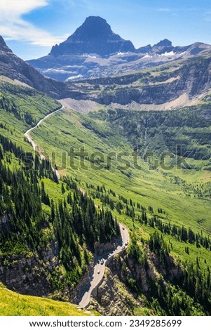 View from Highline trail of the Going-To-The-Sun road leading towards Logan Pass and Reynolds mountain, along Logan creek valley, in Glacier National Park, Montana