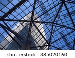 View of high-rise from ground level through glass ceiling