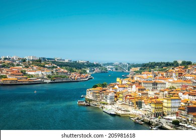 View of the historic city of Porto, Portugal with the Dom Luiz bridge.