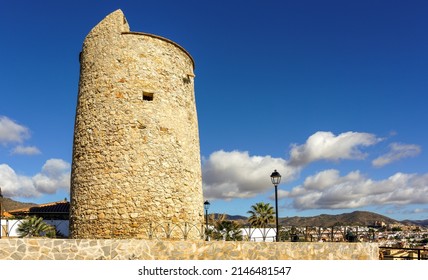 View of historic El Cantal defensive tower watching over the coast of Rincon de la Victoria, Malaga, Spain. - Shutterstock ID 2146481547