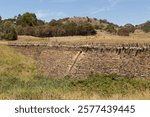 View of the historic Spiky Bridge built in 1843 by convicts from thousands of local field stones originally constructed without mortar or cement. Stones were laid vertically along the parapet