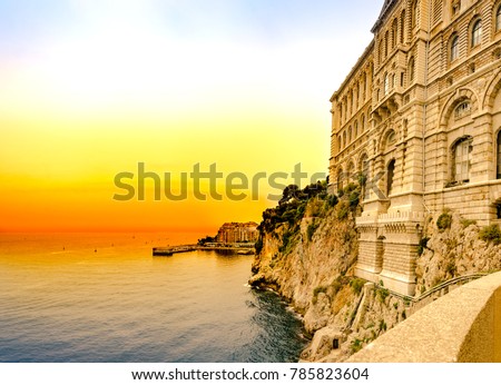 View of the historic stone colorful building Oceanographic Museum on a background of sunset sky. Monte Carlo, Monaco
