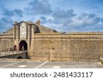 View of the historical Port Louis Citadelle with its ancient stone architecture in Lorient, Bretagne, France.