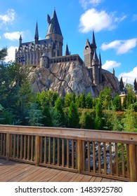 View of Hogwarts Castle from footbridge in Islands of Adventure, Universal Orlando 2017 on a warm November day.