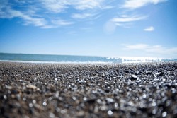 A View Of The Horizon From A Pebbly Beach At Ground Level
