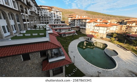 view of a hotel complex with a pool