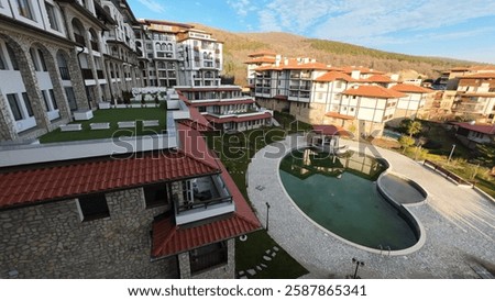 view of a hotel complex with a pool