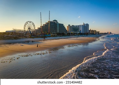 View of hotels and rides along the boardwalk from the fishing pier in Daytona Beach, Florida.