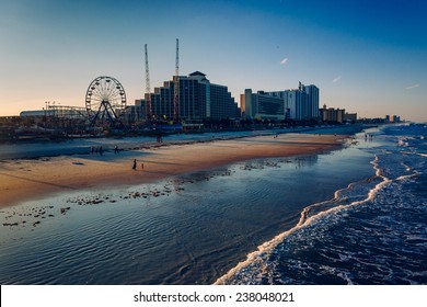 View of hotels and rides along the boardwalk from the fishing pier in Daytona Beach, Florida.