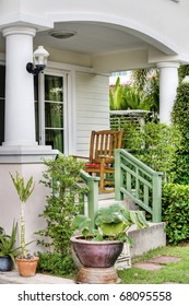 View Of House Porch With  Furniture And Flowers