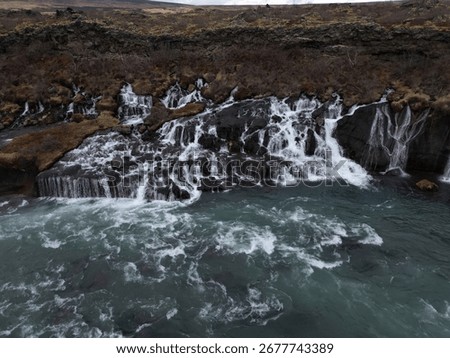 The view of Hraunfossar waterfall with multiple rivulets. Iceland.