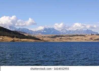 View Of Huaypo Lake In Peru Near Cusco In The Sacred Valley Of The Incas With Andes Mountains In Background During An ATV Tour