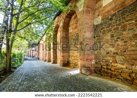 A view of the Huebnerstor city gate and tower in the historic city of Nuremberg in Germany in Europe