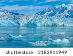 A view of icebergs in front of the snout of the Hubbard Glacier in Alaska in summertime