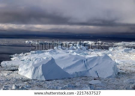 View of icebergs in Ilulissat Icefjord in Disko Bay seen from an airplane   
