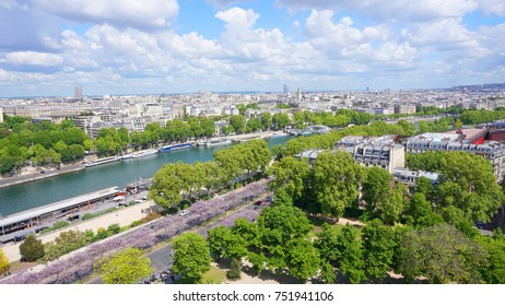 View from iconic Eiffel Tower to river Seine with beautiful scattered clouds on a spring morning, Paris, France