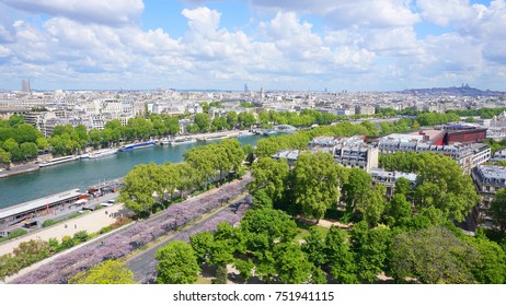 View from iconic Eiffel Tower to river Seine with beautiful scattered clouds on a spring morning, Paris, France