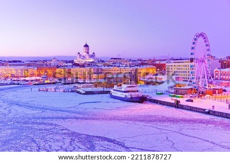 View of the icy harbor at dusk in winter in Helsinki, Finland.