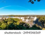 View of the Iguazu Falls, border between Brazil and Argentina. The falls are one of the seven wonders of the world and are located in the Iguaçu National Park, a UNESCO World Heritage Site.