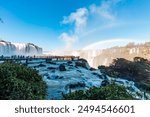 View of the Iguazu Falls, border between Brazil and Argentina. The falls are one of the seven wonders of the world and are located in the Iguaçu National Park, a UNESCO World Heritage Site.