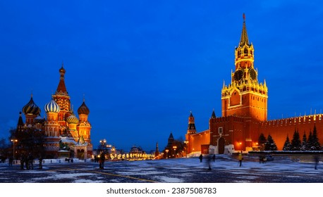 View of illuminated Spasskaya Tower and Saint Basils Cathedral on Red Square in Moscow on winter evening, Russia - Powered by Shutterstock