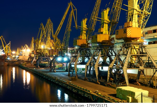 view of the
industrial port at night - ships waiting for loading and unloading,
cargo transportation by
sea