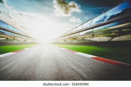 View of the infinity empty asphalt international race track, Motion blurred background . evening scene .