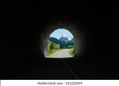 View from inside a bike lane tunnel. Austrian Alps