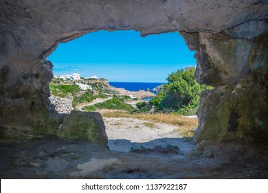 View From The Inside Of Cala Morell Necropolis Caves At Menorca, Spain.