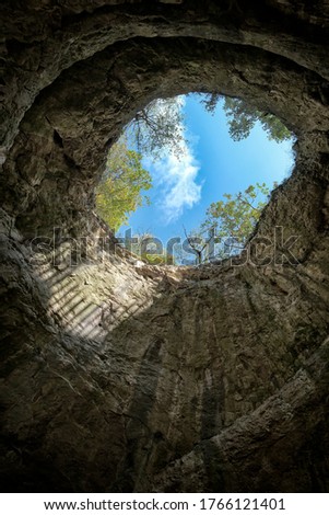 View from inside a cave looking out.