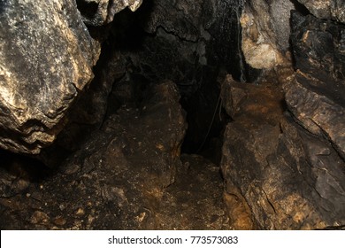 View Inside A Deep Cave. The Dark Abyss.