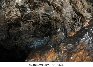 View Inside A Deep Cave. The Dark Abyss.