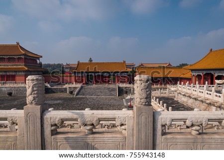 A view from inside the Forbidden City with a view of the decorative stone walls and palace buildings, located in Beijing, China.