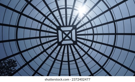 view inside a large aviary dome with curved steel in the form of dome