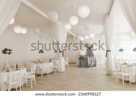 A view inside a marquee set up for a wedding reception. High quality photo