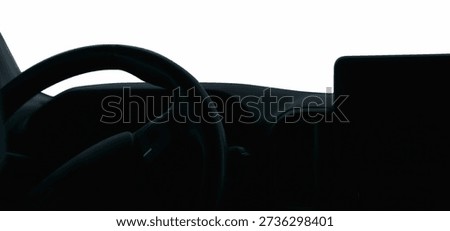 View from the interior of the car panel with steering wheel and monitor