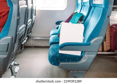 View Of Interior In A Deserted Empty Commuter Train Carriage With Rows Of Seats 