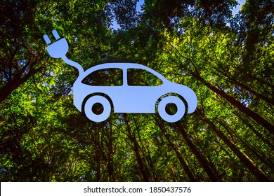 View into the Canopy of a Forest Combined with the Shape of an Electric Car, Cable and Plug
