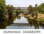 View of the iron rail bridge over the Macquarie River built in 1884 and known as the Lattice Railway Bridge in Dubbo, New South Wales, Australia