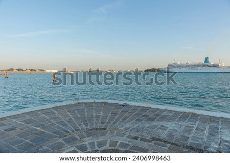 View from Island of Lido to Venice under clear blue sky  as cruise ship arrives Italy for scenic or background use. Foto stock © 