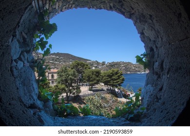 View From A Ivy-covered Castle Window Onto Lipari Harbour And Sea