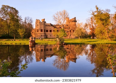 A view to the Janohrad castle and its water reflection in the forest near Lednice, Czech republic	