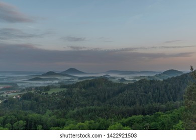 View from Jehla hill over Ceska Kamenice town in spring misty morning in national park - Shutterstock ID 1422921503