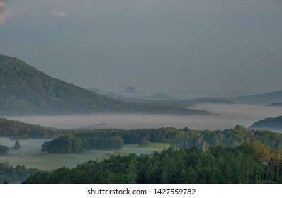 View from Jehla hill over Ceska Kamenice town in spring misty morning in national park - Shutterstock ID 1427559782