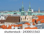 It Is view of Jesuit church (Jesuitenkirche). The University Church (Universitätskirche) is on the Ignaz Seipel Platz in Wien. It is panoramic view of old city center of Vienna. It