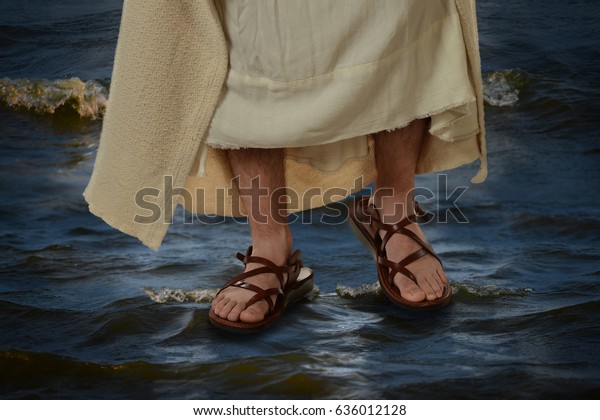 View of Jesus feet\
walking on the water