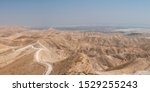 View of the Jordan Valley Desert Mountains and the City of Jericho next to the Dead Sea