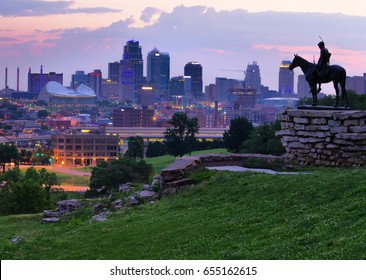 View of Kansas City, Missouri skyline at dawn during golden light from the Kansas City Scout Memorial with all registered trademarks removed.