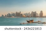 View from Katara Beach timelapse during sunset in Doha, Qatar, towards the West Bay and city center. Old ship on foreground