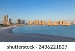 View from Katara Beach timelapse during sunset in Doha, Qatar, towards the Pearl. Residential buildings view